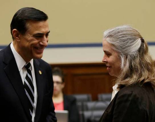 IRS Sarah Hall Ingram chats with Rep Issa before Committee on Oversight and Government Reform on Capitol Hill in Washington